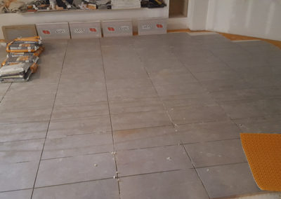 A floor that has been laid out in the middle of the room.