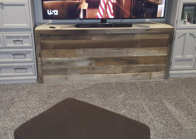 A tv sitting on top of a wooden stand.